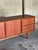 Elevate your interior with a rare and beautifully crafted example of Danish mid-century design — a lowline sideboard...