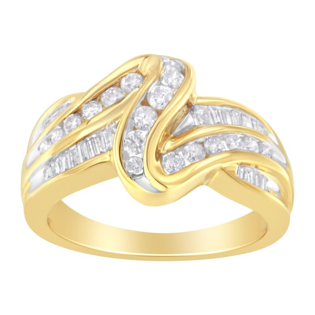 Enjoy this elegant diamond band ring, which features 30 round brilliant cut and 10 baguette diamonds set in an...