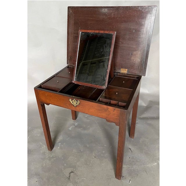 Fine 18th Century Georgian mahogany dressing table with lift top and sliding mirror and removable compartments. Dating...