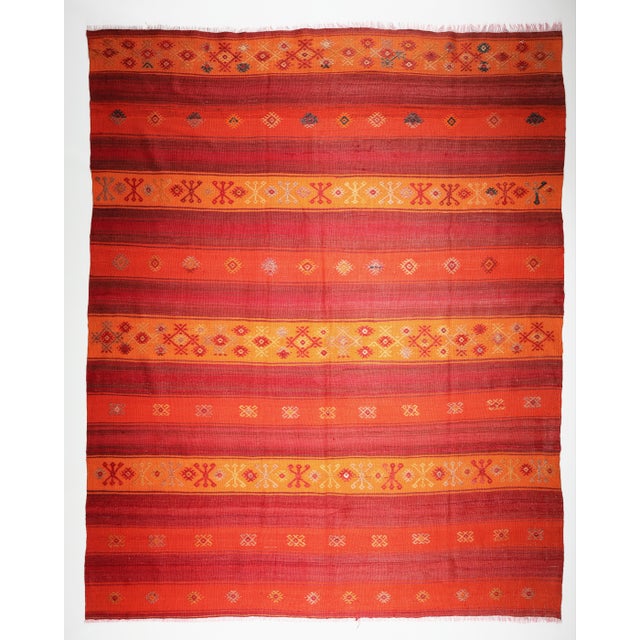 Color: Red Tones, Yellow, Orange, indigo Blue, Purple, This is a one of kind old Nomadic Handwoven village kilim, it is...