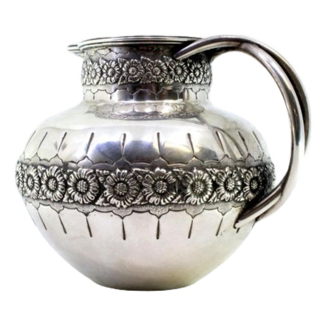 Rounded Silver Wine Jug with Floral Motifs, Double Handle and Beaded Rim For Sale