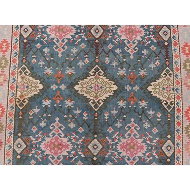 Measures: 5'7 x 14'2 Vintage Turkish Kilim Rug in Blue, Coral, Ivory, and Olive 5'7 x 14'2. Keivan Woven Arts /...