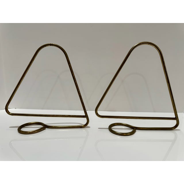 Pair of 1950s Scandinavian modern book holders designed by Kajsa and Nils “Nisse” Strinning for String, Sweden. Minimalist...