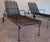 A refined pair of mid-century wrought iron chaise lounges attributed to Woodard Furniture Company, circa 1955–1965. These...