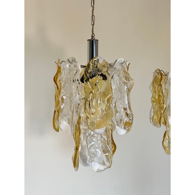 Pair of 70s chandeliers, steel structures and Murano glass plates, the height of the chandelier alone is 50 cm, 4 lights...