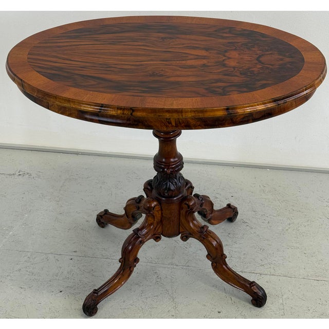 An impressive oval walnut table from the Historicist period, most likely dating to the second half of the 19th century....