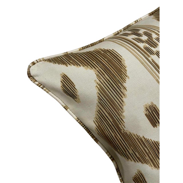 Presenting an exciting new design, this reversible ikat pillow is poised to become a captivating focal point in any home...