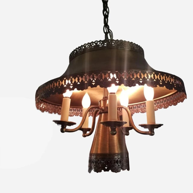 A brassy toned Metal Toleware 6 Light Dining Room Swag Light Fixture. There are 5 Candelabra bulb sections and a single...