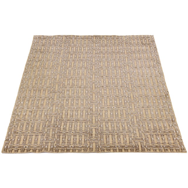 This beautiful modern Soumak hand-knotted wool rug has a tan field. It features beige accents in a gorgeous all-over...