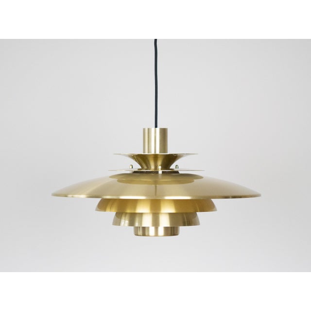 This lamp was designed by Danish designer Kurt Wiborg and manufactured by Jeka. The lamp's form is based on the principle...