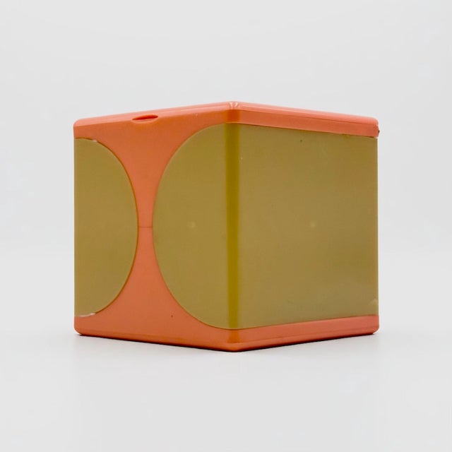 Rare vintage vanity box from the 1970s in salmon and cream plastic. The cube unfolds into a sculptural beauty organizer...