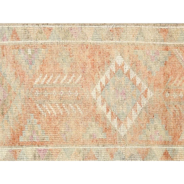 Expertly handwoven in Turkey, this vintage Oushak runner adds a touch of timeless elegance to any space. Measuring 2'10" x...