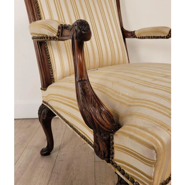 A French open armchair in the Louis XIV style, 19th century. Seat height 17". Needs to be reupholstered.