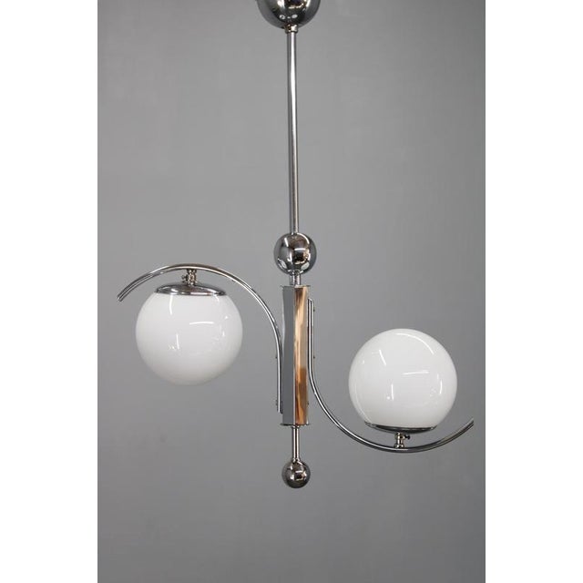 This refined czechoslovak art deco chandelier dates from the 1930s and reflects the elegance and precision of central...
