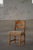 A beautiful and sculptural oak dining chair designed by Henning (Henry) Kjærnulf for Nyrup Møbelfabrik, Denmark, during...