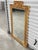 Vintage Italian Rococo style giltwood mirror with hand-carved shell crown motif and leaf accents. This exquisite mirror...