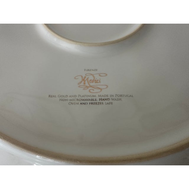 Juliska stoneware gold marbled "Firenze" can be used as a traditional charger or serving piece. Due to the gold and...