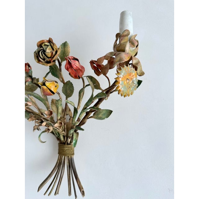 This vintage italian wall sconce is a two-light fitting in hand-painted tôle, maker unknown, estimated to date from the...