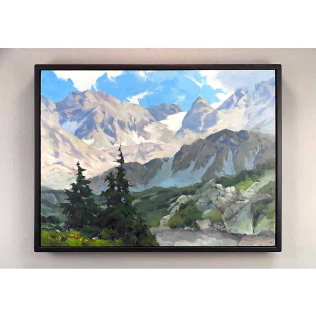 This artwork depicts a serene mountain landscape, where towering peaks rise majestically against a bright blue sky,...