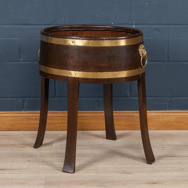A delightful oak jardiniere or wine cooler made in England around the middle of the 20th century. As is so typical of...
