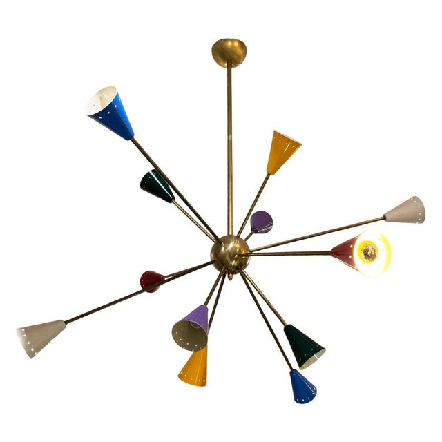 Stunning Italian Sputnik ceiling lamp from the 1970s. Its structure consists of a central gold-plated metal sphere from...