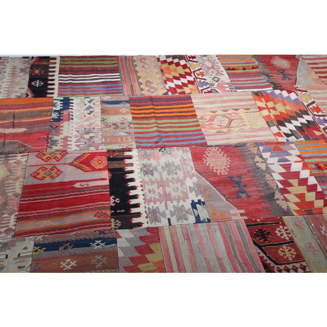 Authentic Turkish Kilim Patchwork Rug With Tribal & Geometric Designs This striking patchwork kilim is handcrafted from...