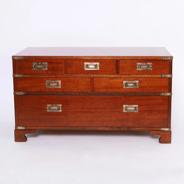 Handsome British Colonial chest crafted in mahogany with six drawers in a low profile with brass campaign hardware and...