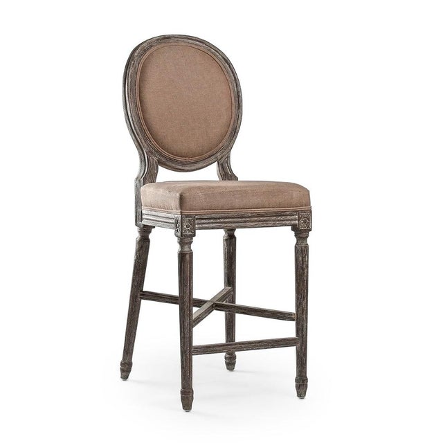 The Medallion Counter Stool from Zentique brings the iconic Louis XVI oval-back (medallion) silhouette to counter height...