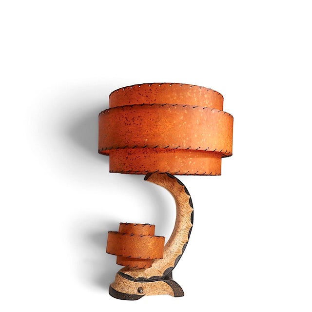 Classic 1950's American table lamp, having two fiberglass, two tier shades, which mount on the cast plaster base. This...