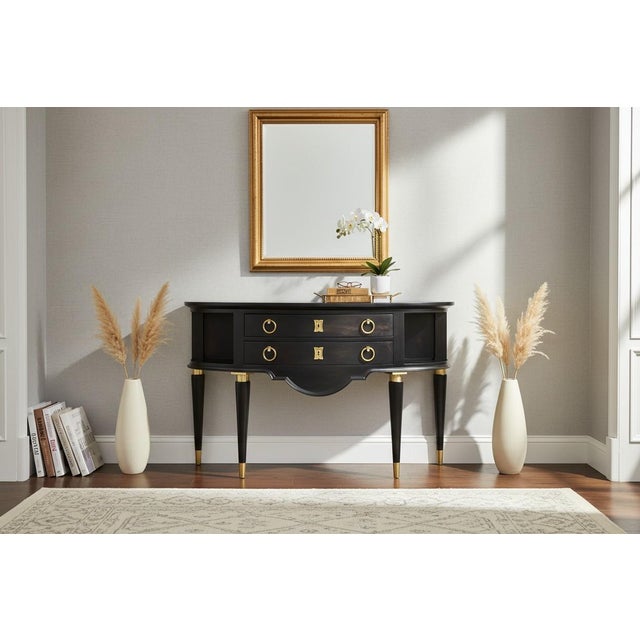 Elegant and timeless, this demi-lune server beautifully blends Hollywood Regency glamour with French Neoclassical...
