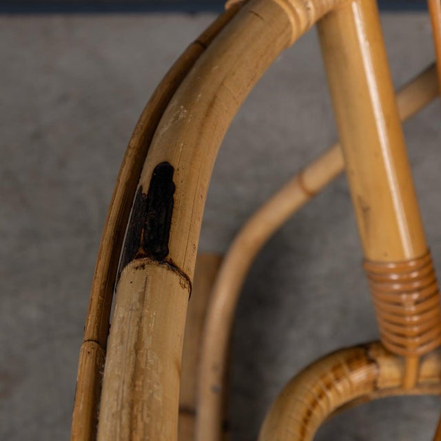 A stunning mid-century rocking chair crafted in Italy in the 1960s. Featuring a rattan seat and a carefully constructed...