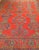 A vintage Turkish Oushak room-size rug from the early 20th century that immediately captivates with its beautiful and rich...