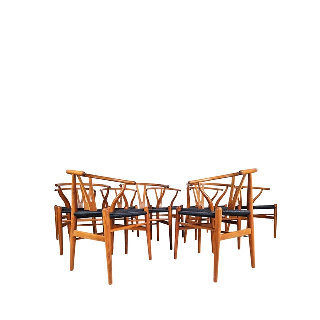 A masterpiece of Danish modern design, the Hans Wegner CH24 Wishbone Chair, crafted by Carl Hansen & Sons, embodies the...