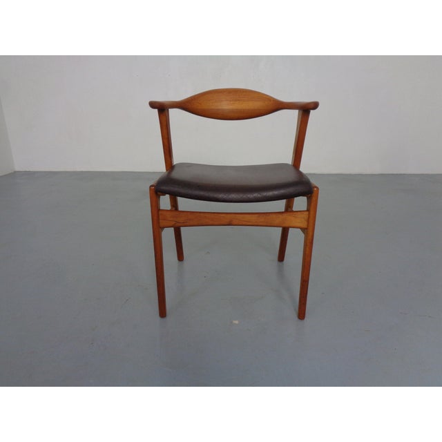 Teak armchair by Erik Kirkegaard for Høng Stolefabrik from the 1960s. Seat with the original, patinated brown leather...