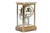 An antique brass four-glass crystal regulator mantel clock by the New Haven Clock Co. with a beveled glass case, white...