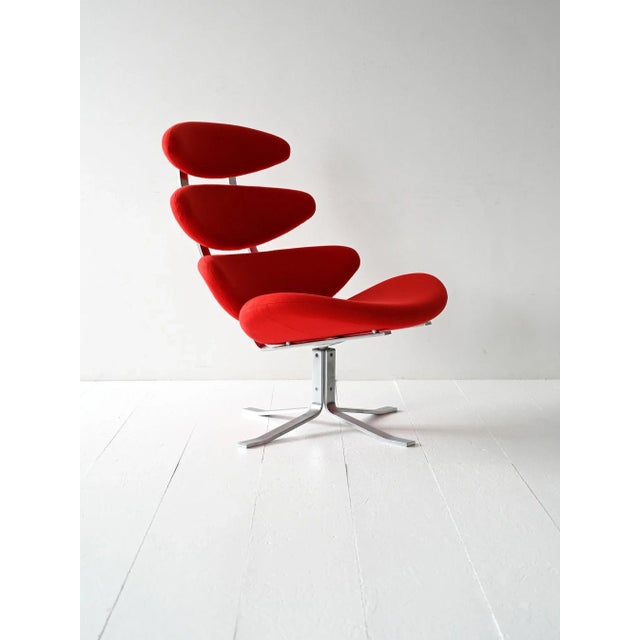 Original Corona armchair by Poul M. Volther for Erik Jørgensen, with a steel frame and red fabric upholstery. Designed in...