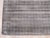 A handwoven viscose flatweave, made in India and measuring 8'9"' x 11'9"'. An open, largely solid field with restrained...