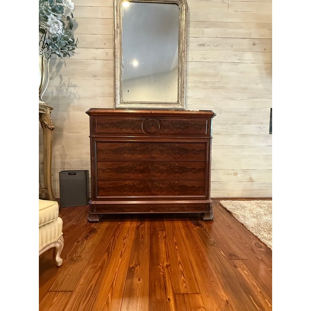 A handsome 19th century French secretaire a abattant featuring richly figured flame mahogany veneers and beautifully...