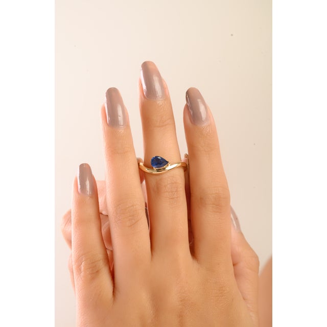 Modern Pear Cut Prong Set Deep Blue Sapphire Wave Ring in 14k Yellow Gold Size 6 For Sale In New York - Image 6 of 13