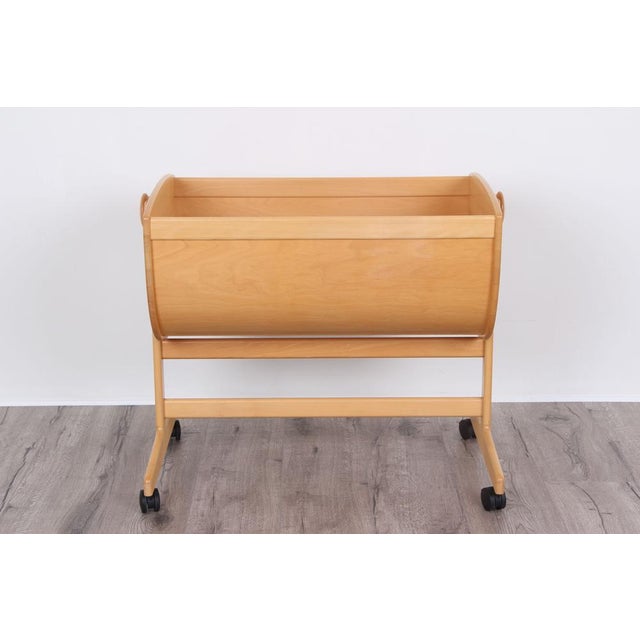 Nanna Ditzel designed this cradle in 1964. Here you can buy a newer model made of lightly painted beech wood. Starting...