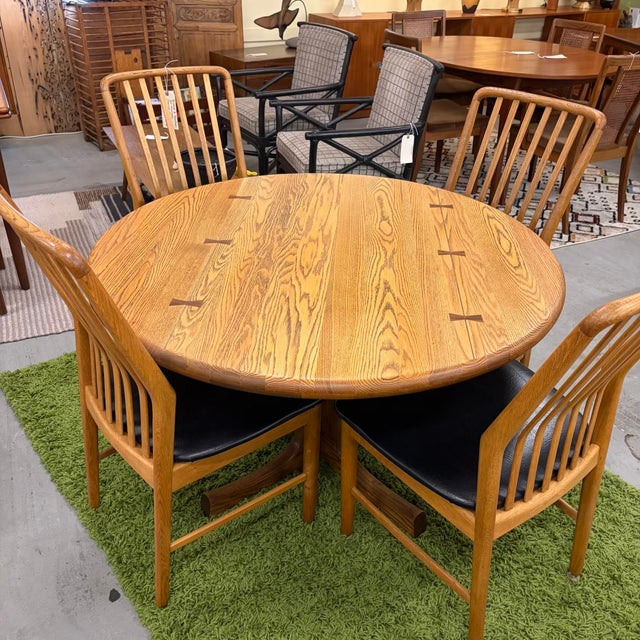 Vintage solid oak dining table with pedestal base and faux butterfly joints with beautifully refinished top, ready for a...