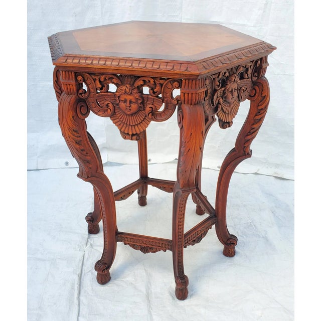 Beautiful angel or cherub carved lamp table. Amazing detail in the winged carved figures as well as the other carving on...