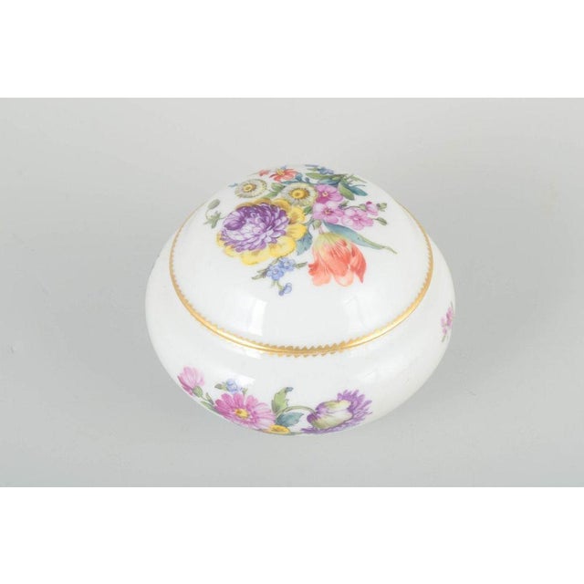 Royal Copenhagen Saxon Flower lidded jar, c. 1900. Elegant round porcelain jar with lid, decorated with hand-painted...