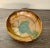 Beautiful turquoise and tan glaze 10” studio bow made in 1986. Use on your side or coffee table or serve salad in it!