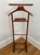 Handsome solid wood gentleman's valet or butler. With shirt grips on top and brass extenders than can be adjusted in or...