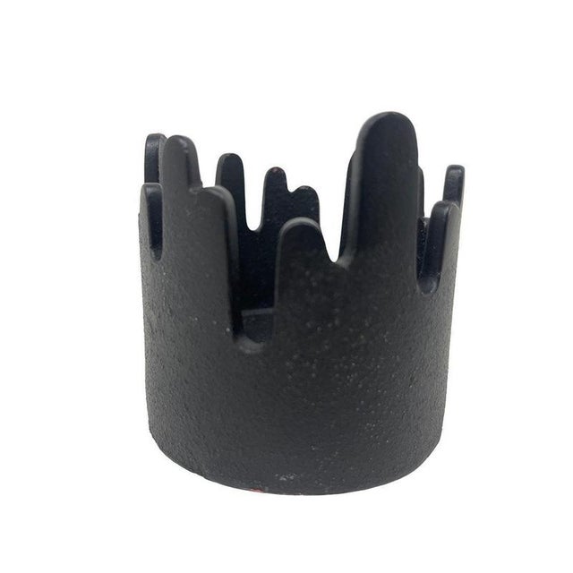 Candlestick "Summit" by Christel & Christer Holmgren, 1970s This Danish candlestick made of cast iron with a wavy top edge...
