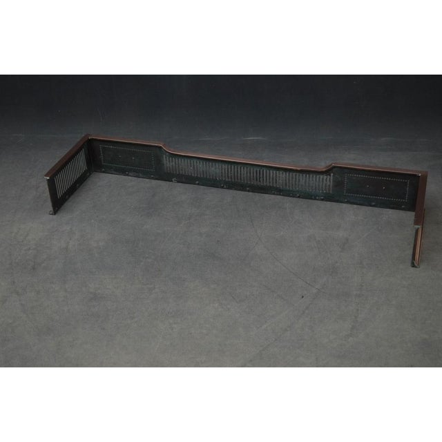 Most attractive late Victorian copper fender, having floral motifs with beaded borders and pierced decoration to sides and...