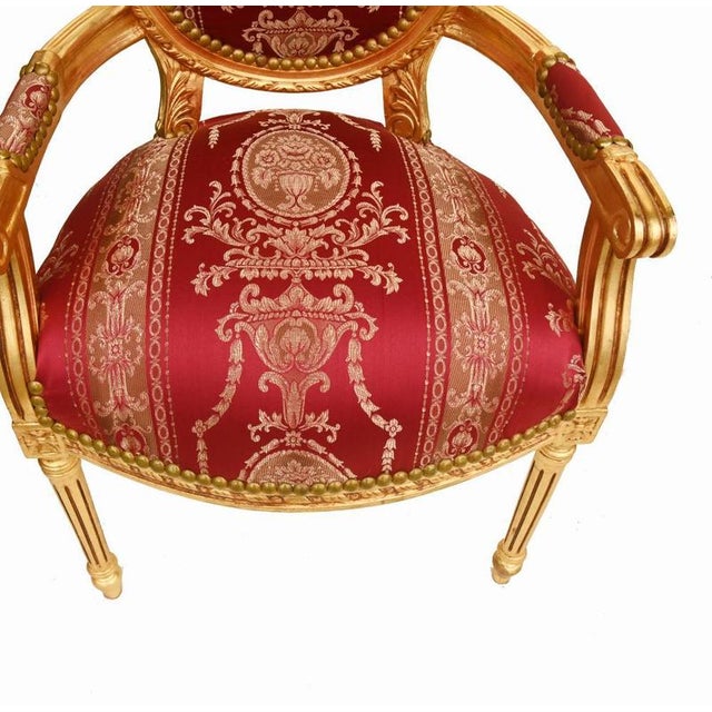 A very elegant pair of french louis xvi style fauteuil armchairs, richly finished in giltwood with beautifully carved...
