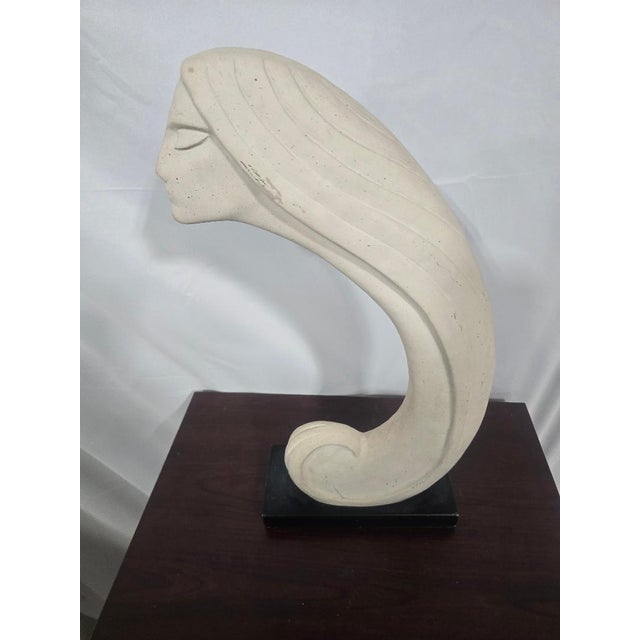An exceptional vintage decorative sculpture evocative of Art Deco and Art Moderne aesthetics, originally retailed by...