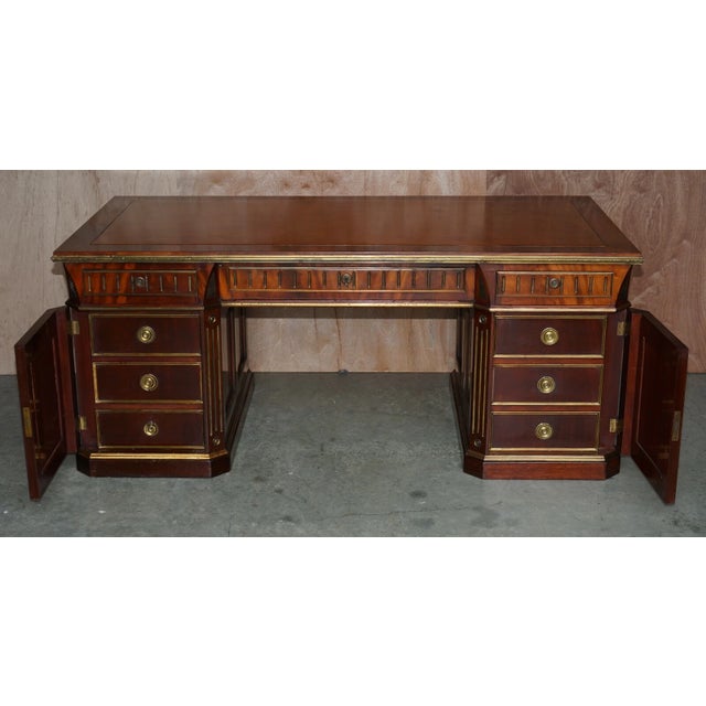 An exceptional, museum-quality 19th-century antique Russian mahogany partner desk complete with its matching classical...